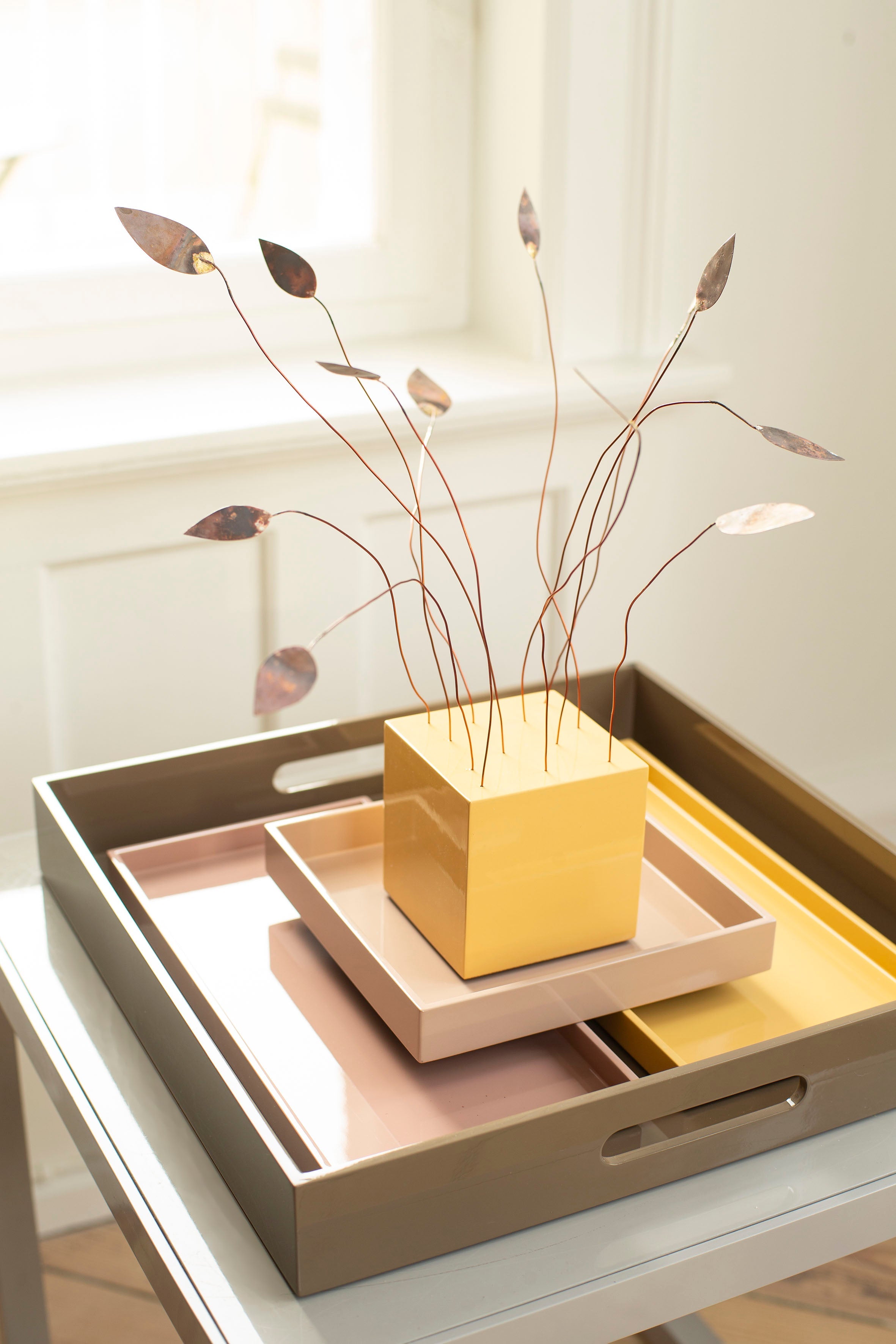 Square block w metal leaves, sun